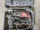 a tool in a case that is sitting on the floor