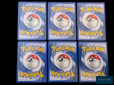 four plastic pokemon cards with a red and white poke - n - poke ball on them