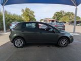 a picture of a small car parked in a parking lot