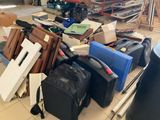 many pieces of luggage sitting on the floor in the garage