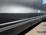 a black car with a black stripe on the side of it