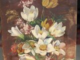 a picture of a painting of flowers on a easel