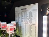 bottles of water are lined up on a shelf in a refrigerator