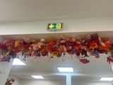 a floral arrangement on the ceiling above a mirror