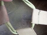 a close up of a person ' s hand holding a piece of luggage