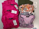 a lot of clothes that are on a table
