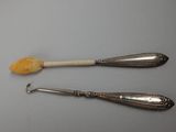 two spoons and a spoon with a piece of bread on them