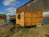a trailer with a horse in the back of it
