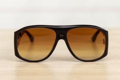 a close up of a pair of sunglasses on a table