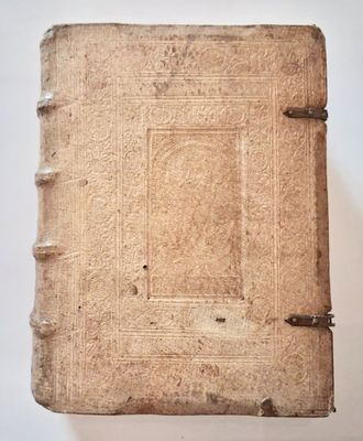 an old book sitting on top of a white table