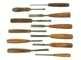 several different types of woodworking tools are lined up on a white surface