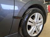 a close up of a tire on the side of a car