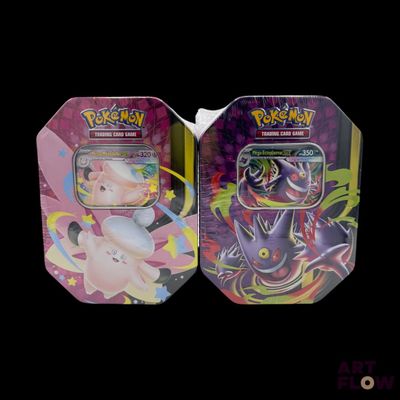 two tins of pokemon cards are sitting side by side on a black background