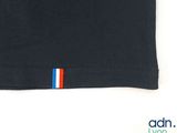 a close up of a black t - shirt with a red, white, and blue stripe on the chest