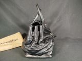 a black purse with a pair of scissors in it