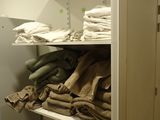 a closet full of clothes and other items in the room