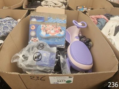 a cardboard box filled with baby items in a store