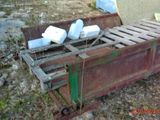 a bed that is sitting on the ground in the dirt
