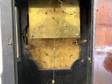 a black and gold clock that is on display