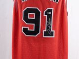 a red basketball jersey with the number 91 on it
