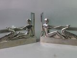 pair of art deco bookends in the shape of a woman and a man