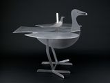 two birds that are sitting on a table