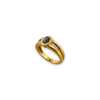 Bague en or jaune 18K (750) sertie d'un saphir ovale épaulé …