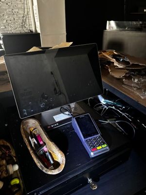 a laptop and a cell phone sitting on a table
