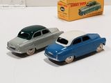 three toy cars sitting next to each other on a table