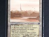 a close up of a card with a picture of a city in the background