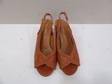 a pair of women ' s shoes on a white surface