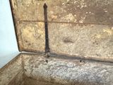 a wooden box with a metal latch in it