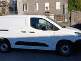a white van that is parked on the side of the street