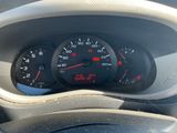 a close up of a car dashboard with a speedometer and gauges