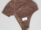 an image of a brown hat with a tag on it