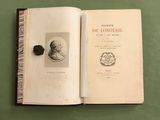 un livre sur lequel figure la photo d'un homme portant un chapeau