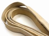 a close up of a leather strap on a white surface