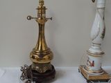 two lamps that are sitting on a table next to each other