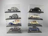 six different models of cars in a display case