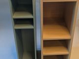two shelves that are next to each other on a table