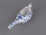 a small blue and white bird shaped dish on a table