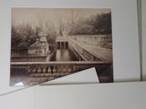 an old photo of a bridge over a river