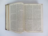 an open book on a table with a white background