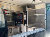 an image of a food truck parked in a parking lot