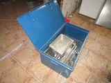 a blue box with a silver pan inside of it