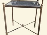 an image of a metal table with a glass top