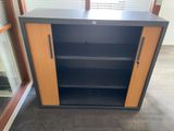 an image of a black and wood cabinet in a room