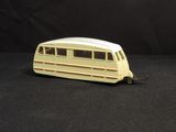 a toy bus that is sitting on a black surface