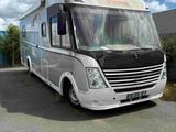 an image of a motor home parked in a parking lot