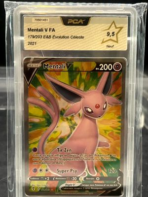 a close up of a pokemon card in a plastic case